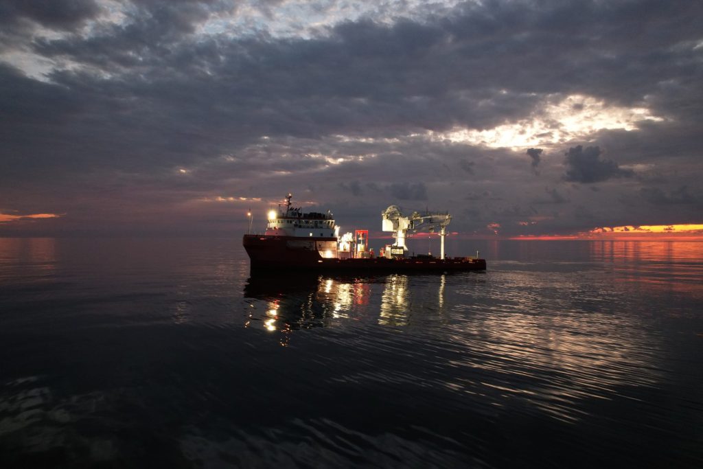 Offshore construction vessel at sunrise in the Gulf of Mexico